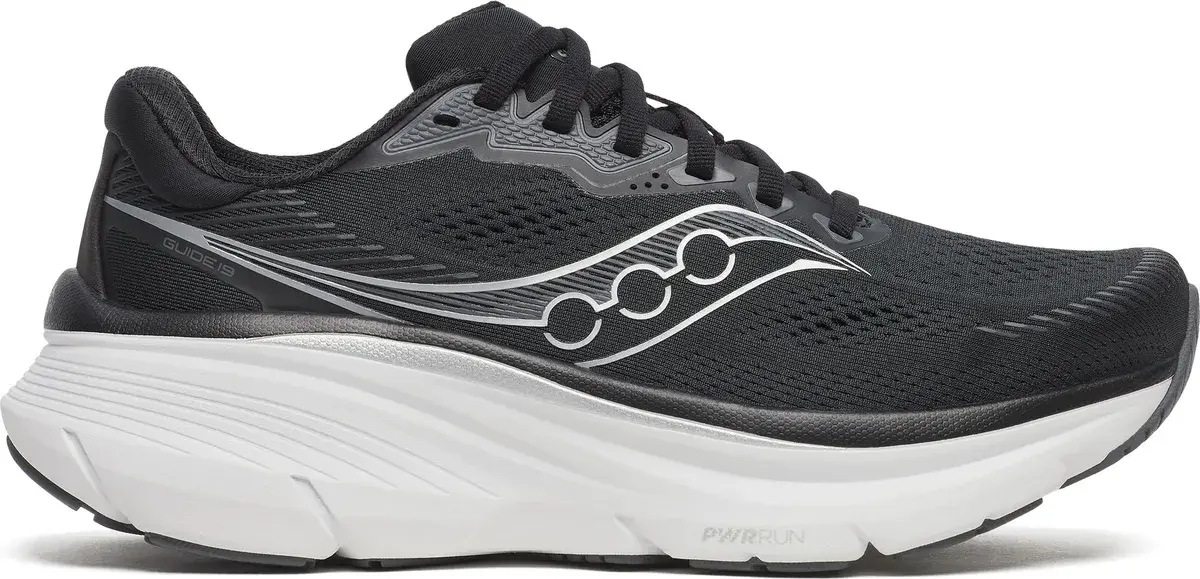 Saucony Guide 19 stabilitetssko for dame i svart med sølvfarget detalj, sett fra siden
